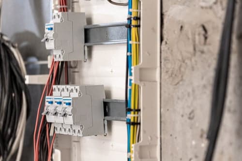 Licensed electricians working on a residential electrical installation in Palmdale, California