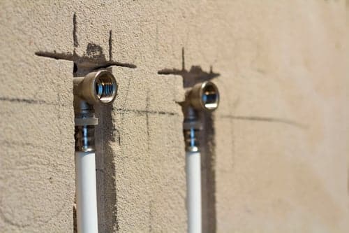 Exterior electrical conduit stubs and bonded connections forming part of a residential grounding system