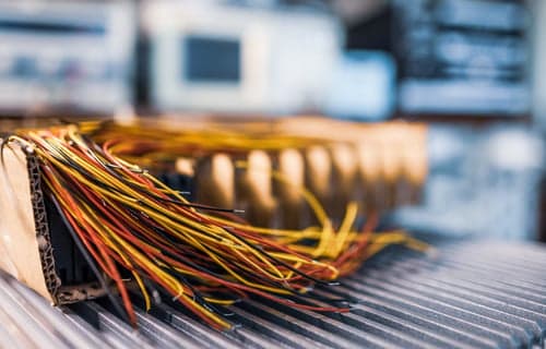 Electrician reviewing wiring documentation on a residential electrical project