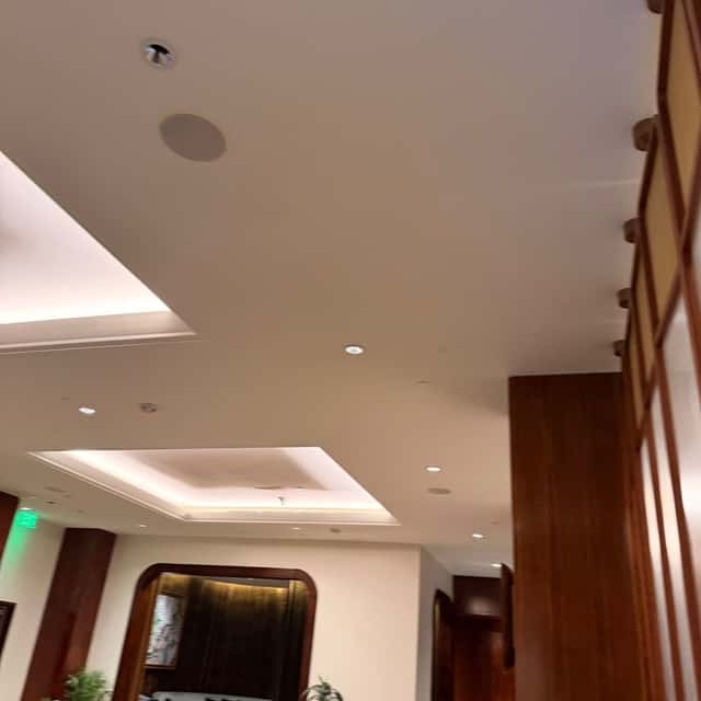 Cove lighting and recessed downlights across a commercial lobby ceiling — Nebady's Electric Corporation, Palmdale, CA