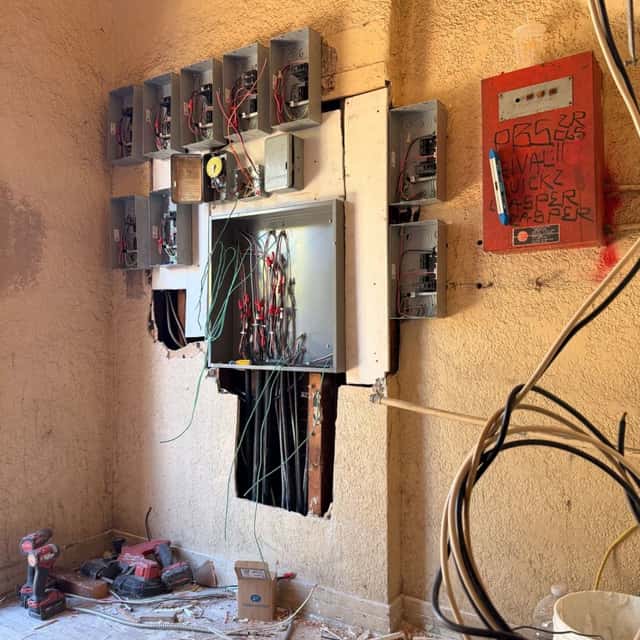 Multi-meter electrical service and fire alarm panel wall mid-installation — Nebady's Electric Corporation, Palmdale, CA