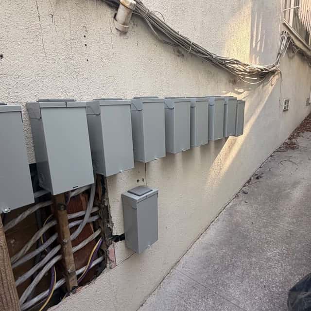 Row of new electrical disconnects mounted along an exterior wall — Nebady's Electric Corporation, Palmdale, CA