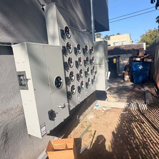 Multi-meter service bank on a commercial building exterior — Nebady's Electric Corporation, Palmdale, CA
