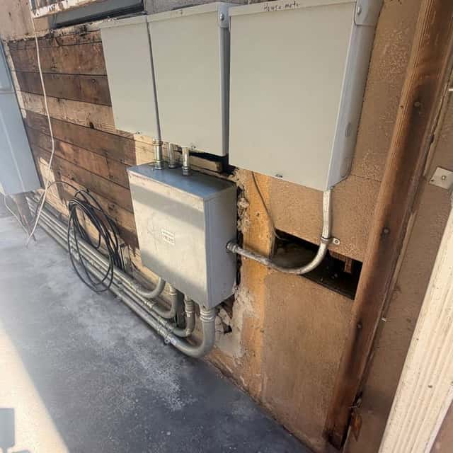Service disconnect box and conduit on an exterior stucco wall — Nebady's Electric Corporation, Palmdale, CA