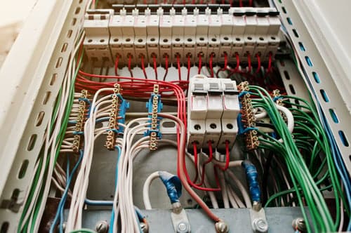 Neatly terminated residential wiring inside an electrical distribution board serviced by a licensed electrician